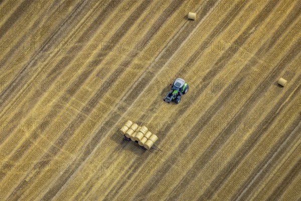 Aerial view, tractor harvesting grass, Mündelheim, Duisburg, Ruhr area, North Rhine-Westphalia, Germany, DE, Europe, grass bales, aerial view, aerial photography, aerial photography, overview, bird's eye view, meadows and fields, birds-eyes view, overview