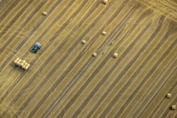 Aerial view, tractor harvesting grass, Mündelheim, Duisburg, Ruhr area, North Rhine-Westphalia, Germany, DE, Europe, grass bales, aerial view, aerial photography, aerial photography, overview, bird's eye view, meadows and fields, birds-eyes view, overview