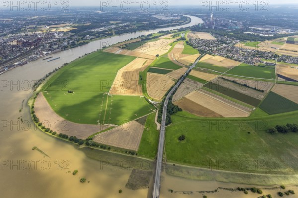 Aerial view, Rhine meadows Mündelheim and Rheinaue Ehingen, river Rhine Rhine arch, Uerdinger Rhine bridge, Mündelheim, Duisburg, Ruhr area, North Rhine-Westphalia, Germany, inland navigation, bridge, DE, Europe, river, river course, suspension bridge, Krefeld-Uerdinger bridge, Krefelder Straße, landscape conservation area, aerial view, aerial photography, aerial photography, Rhine arch, overview, bird's-eye view, birds-eyes view, overview