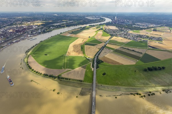 Aerial view, Rhine meadows Mündelheim and Rheinaue Ehingen, river Rhine Rhine arch, Uerdinger Rhine bridge, Mündelheim, Duisburg, Ruhr area, North Rhine-Westphalia, Germany, inland navigation, bridge, DE, Europe, river, river course, suspension bridge, Krefeld-Uerdinger bridge, Krefelder Straße, landscape conservation area, aerial view, aerial photography, aerial photography, Rhine arch, overview, bird's-eye view, birds-eyes view, overview