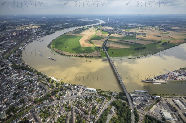 Aerial view, Krefeld-Uerdingen bridge, flood river Rhine, flooding Rhine floodplain Mündelheim, Rhine bend, Rhine floodplain Ehingen, Duisburg, Mündelheim, Ürdingen, Krefeld, Ruhr area, North Rhine-Westphalia, Germany, bridge, DE, Europe, flood, flood of the century, aerial view, aerial photography, aerial photography, water level Duisburg, Rhine flood, heavy rain, overview, bird's eye view, overview, flooding