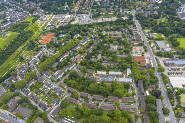 Aerial view, construction site and renovation of Vonovia houses in Rembrandtstraße, Hüttenheim, Duisburg, Ruhr area, North Rhine-Westphalia, Germany, construction work, construction area, building site, building plots, construction crane, construction project, construction site, DE, Europe, aerial view, aerial photography, aerial photography, aerial photography, renovation, refurbishment, overview, bird's eye view, birds-eyes view, overview