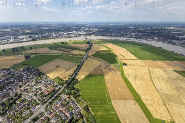 Aerial view, Rhine meadows Mündelheim and Rheinaue Ehingen, river Rhine Rhine arch, Uerdinger Rhine bridge, Mündelheim, Duisburg, Ruhr area, North Rhine-Westphalia, Germany, inland navigation, bridge, DE, Europe, river, river course, suspension bridge, Krefeld-Uerdinger bridge, Krefelder Straße, landscape conservation area, aerial view, aerial photography, aerial photography, Rhine arch, overview, bird's-eye view, birds-eyes view, overview