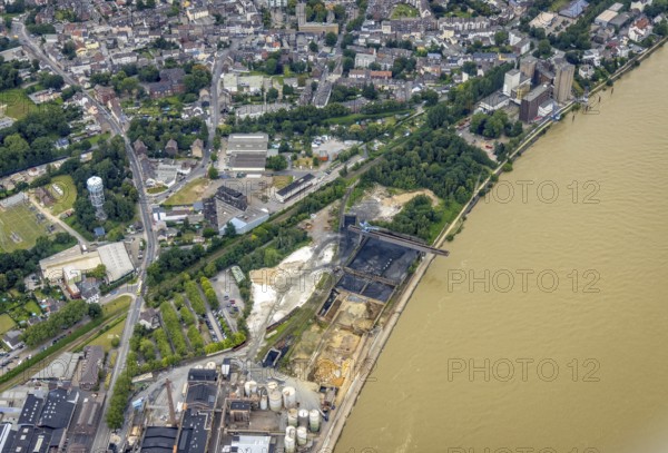 Aerial view, Rheinufer Essenberg, commercial area Duisburger Straße, coal storage on the river Rhine, Alt-Homberg, Duisburg, Ruhr area, North Rhine-Westphalia, Germany, DE, Europe, commercial enterprises, commercial area, commercial site, commercial use, industrial area, industrial building, industrial site, aerial photograph, aerial photography, aerial photography, overview, bird's eye view, birds-eyes view, overview