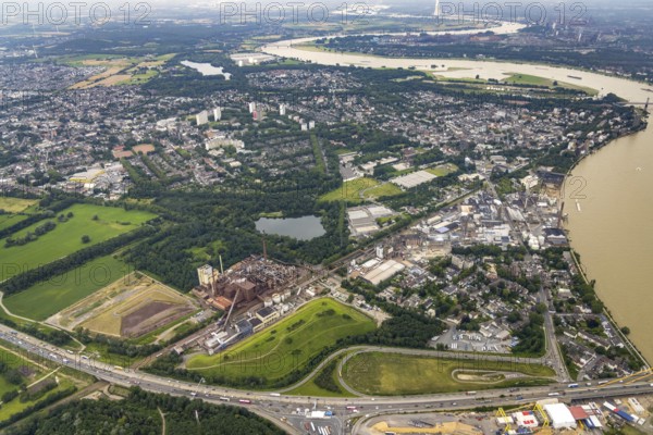 Aerial view, Rheinufer Essenberg, commercial area Duisburger Straße, coal storage on the river Rhine, Alt-Homberg, Duisburg, Ruhr area, North Rhine-Westphalia, Germany, DE, Europe, commercial enterprises, commercial area, commercial site, commercial use, industrial area, industrial building, industrial site, aerial photograph, aerial photography, aerial photography, overview, bird's eye view, birds-eyes view, overview