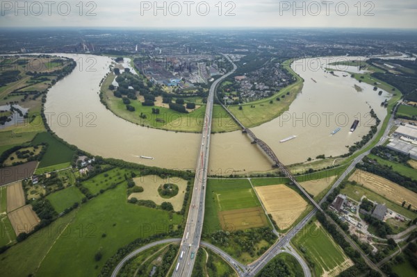 Aerial view, flood river Rhine, motorway A42 Beeckerwerther Brücke and Haus-Knipp-Eisenbahnbrücke with view of Beeckerwerth, Rheinbogen, Bärl, Duisburg, Ruhr area, North Rhine-Westphalia, Germany, motorway, bridge, DE, Europe, flood, flood of the century, aerial view, aerial photography, aerial photography, aerial photography, gauge Duisburg, Rhine flood, heavy rain, overview, bird's-eye view, overview, flooding