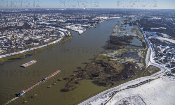 Aerial photo, flooding river Rhine, cargo ships, Bergheim, Duisburg, Ruhr area, North Rhine-Westphalia, Germany, DE, Europe, freight transport, aerial photo, aerial photography, aerial photography, shipping, snow, overview, bird's eye view, winter, birds-eyes view, cleared roads, overview, flood, Rhine flood, winter flood