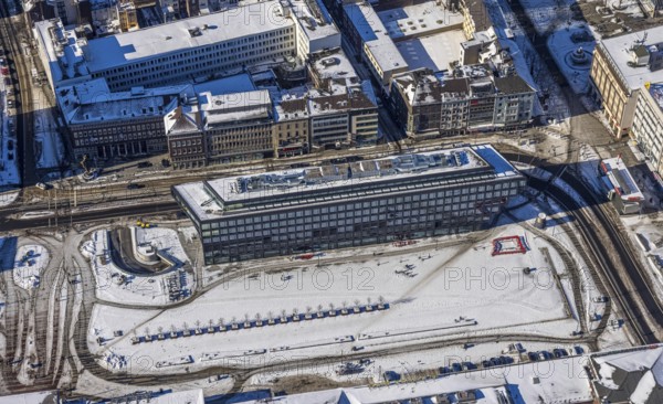 Aerial view, construction site station forecourt, Mercator One Duisburg, Mercatorstraße, Duisburg, Ruhr area, North Rhine-Westphalia, Germany, railway station, station forecourt, DE, Deutsche Bahn AG, Europe, gastronomy, central station, main station, hotel, hotel facilities, hotel business, aerial view, aerial photography, aerial photography, Portsmouthplatz, snow, overview, bird's eye view, winter, birds-eyes view, cleared roads, overview