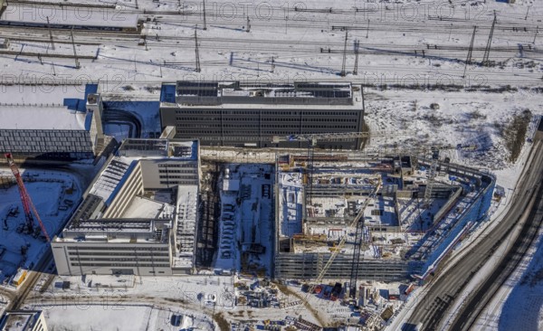 Aerial view, construction site new building Quartier 1 Wuhanstrasse, State Office for Nature Environment and Consumer Protection North Rhine-Westphalia, Dellviertel, Duisburg, Ruhr area, North Rhine-Westphalia, Germany, DE, Europe, aerial view, aerial photography, aerial photography, snow, overview, bird's eye view, winter, birds-eyes view, cleared roads, overview