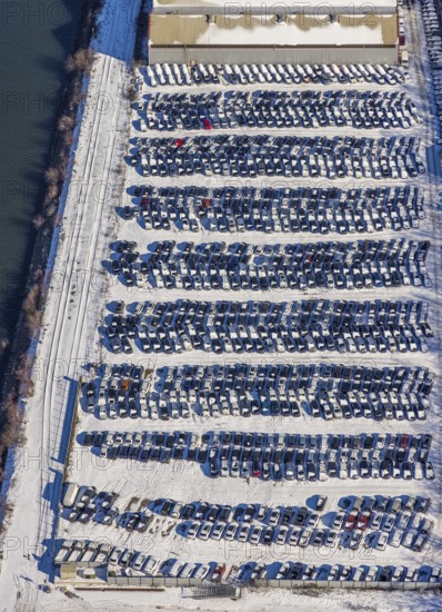 Aerial photo, car warehouse Salloum Logistics, Pontwert, Ruhrort, Duisburg, Ruhr area, North Rhine-Westphalia, Germany, Am Hafenkanal, DE, Europe, storage, logistics, logistics service, logistics service provider, logistics provider, aerial photo, aerial photography, aerial photography, car logistics, snow, overview, bird's eye view, winter, birds-eyes view, cleared roads, overview