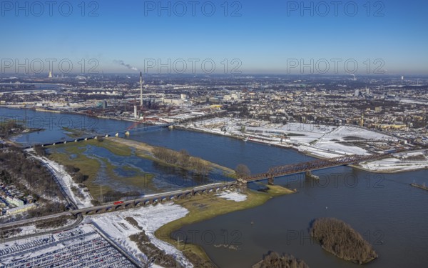 Aerial view, Rheinhausen bridge tower with Hochfeld railway bridge, Rhine river, demolition of wire rolling mill for new Rheinort district, Rhine river and flooding, Friemersheim, Duisburg, Ruhr area, North Rhine-Westphalia, Germany, bridge, bridge of solidarity, DE, Europe, shapes and colours, aerial view, aerial photography, aerial photography, snow, overview, bird's-eye view, winter, birds-eyes view, cleared roads, overview