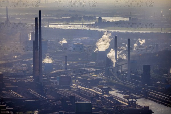 Aerial view, thyssenkrupp Steel Europe backlit, river Rhine, Marxloh, Duisburg, Ruhr area, North Rhine-Westphalia, Germany, DE, Europe, commercial enterprises, commercial area, commercial site, commercial use, industrial area, industrial building, industrial site, aerial photograph, aerial photography, aerial photography, overview, bird's-eye view, overview, industrial scenery, industrial romance, emission, air pollution, dieseliness