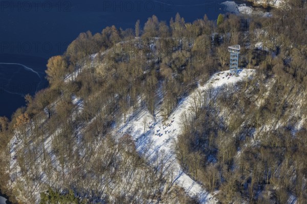 Aerial view, Sechs-Seen-Platte, sledging at the Haubachwald observation tower, Wedau, Duisburg, Ruhr area, North Rhine-Westphalia, Germany, viewing platform 6-Seen-Platte, observation tower, DE, Europe, aerial view, aerial photography, aerial photography, snow, overview, bird's eye view, forest area, winter, birds-eyes view, cleared roads, overview