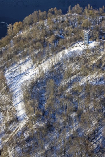Aerial view, Sechs-Seen-Platte, sledging at the Haubachwald observation tower, Wedau, Duisburg, Ruhr area, North Rhine-Westphalia, Germany, viewing platform 6-Seen-Platte, observation tower, DE, Europe, aerial view, aerial photography, aerial photography, snow, overview, bird's eye view, forest area, winter, birds-eyes view, cleared roads, overview