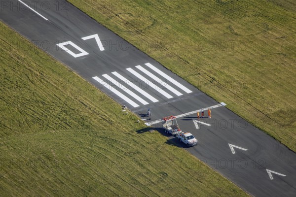Aerial photograph, marking work on the runway at Brilon-Thülen airfield in the Thülen district of Brilon, Sauerland, North Rhine-Westphalia, Germany, construction project, construction site, Brilon, DE, Europe, airfield and landing site, aerial photograph, aerial photography, aerial photography, overview, bird's-eye view, overview