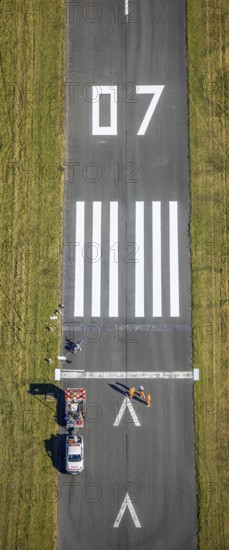 Aerial photograph, marking work on the runway at Brilon-Thülen airfield in the Thülen district of Brilon, Sauerland, North Rhine-Westphalia, Germany, construction project, construction site, Brilon, DE, Europe, airfield and landing site, aerial photograph, aerial photography, aerial photography, overview, bird's-eye view, overview