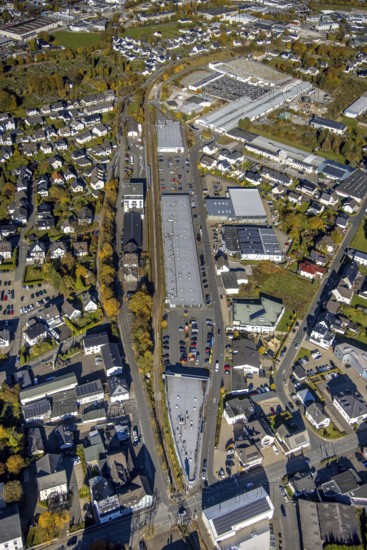 Aerial view, commercial area shopping centre on Freiladestrasse in Brilon, Sauerland, North Rhine-Westphalia, Germany, Brilon, DE, Europe, distant view, commercial enterprises, commercial area, commercial location, commercial use, industrial area, industrial building, industrial location, aerial photograph, aerial photography, aerial photography, aerial view, townscape, overview, bird's-eye view, wind energy, wind turbine, wind power, wind energy plant, wind farm, wind turbines, bird's-eye view, overview