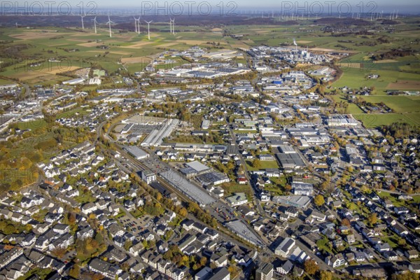 Aerial view, industrial area Brilon with Egger Holzwerkstoffe GmbH and wind farm in the background in Brilon, Sauerland, North Rhine-Westphalia, Germany, Brilon, DE, Europe, distant view, commercial enterprises, commercial area, commercial area, commercial location, commercial use, industrial area, industrial building, industrial site, aerial view, aerial photography, aerial photography, town view, townscape, overview, bird's-eye view, WEA, wind energy, wind energy plant, wind power, wind power plant, wind farm, wind turbines, birds-eyes view, overview