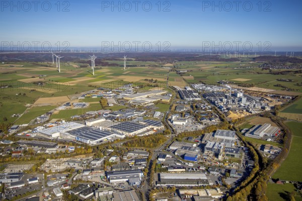 Aerial view, industrial area Brilon with Egger Holzwerkstoffe GmbH and wind farm in the background in Brilon, Sauerland, North Rhine-Westphalia, Germany, Brilon, DE, Europe, distant view, commercial enterprises, commercial area, commercial area, commercial location, commercial use, industrial area, industrial building, industrial site, aerial view, aerial photography, aerial photography, town view, townscape, overview, bird's-eye view, WEA, wind energy, wind energy plant, wind power, wind power plant, wind farm, wind turbines, birds-eyes view, overview