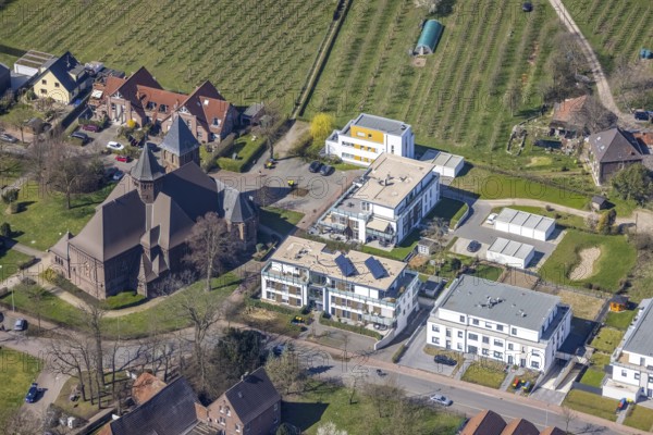 Aerial view, catholic St. St. John's Church, new condominium building Eppinkstraße, Eppinghoven, Dinslaken, Ruhr area, North Rhine-Westphalia, Germany, place of worship, DE, Europe, religious community, place of worship, property tax, holy place, real estate, Kerkmannstraße, church, parish, denomination, aerial view, aerial photography, aerial photography, Lower Rhine, religion, religious site, Rhine, overview, bird's-eye view, residential area, living and life, residential area, residential buildings, quality of life, residential neighbourhood, housing estate, birds-eyes view, overview
