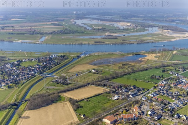 Aerial view, Rhine dyke construction site, Emscher estuary, Emscher estuary drop structure, Emscher bridge Hagelstraße, Rheinaue Walsum, river Emscher, river Rhine, city border to Voerde, Eppinghoven, Dinslaken, Ruhr area, North Rhine-Westphalia, Germany, DE, Emscher, Emscher estuary into the Rhine, Emscher conversion, Europe, Frankfurter Straße, aerial view, aerial photography, aerial photography, estuary, Lower Rhine, Rhine, Rhine floodplain, overview, bird's-eye view, meadows and fields, living and life, birds-eyes view, new Emscher estuary Voerde city boundary, overview