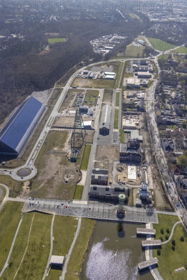 Aerial view, Bergpark Lohberg, former Lohberg colliery site, winding tower, water tower, Lohberg colliery workshop, Oberlohberg, Dinslaken, Ruhr area, North Rhine-Westphalia, Germany, construction area, construction site, construction project, CO2-neutral site, DE, Europe, design concept, commercial area, commercial use, green area, Hünxer Straße, industrial plants, industrial area, industrial site, Lohberg power station, Lohberg creative quarter, roundabout, culture, aerial view, aerial photography, aerial photography, Lower Rhine, Ober-Lohberg-Allee, park, overview, bird's-eye view, birds-eyes view, former Lohberg coal mine, former colliery site, creative use, cultural use, overview