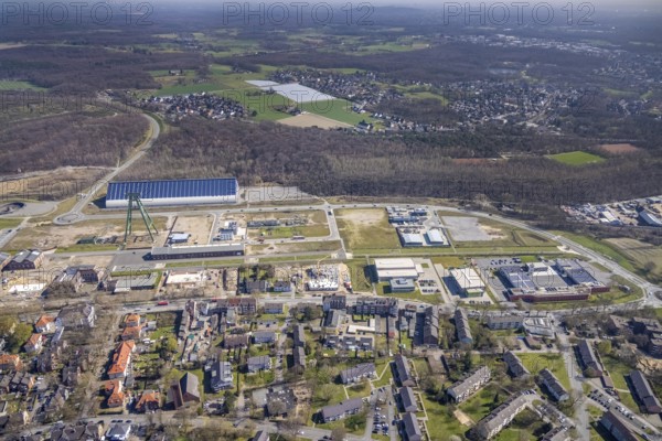Aerial view, Bergpark Lohberg, former Lohberg colliery site, winding tower, water tower, Lohberg colliery workshop, Oberlohberg, Dinslaken, Ruhr area, North Rhine-Westphalia, Germany, construction area, construction site, construction project, CO2-neutral site, DE, Europe, design concept, commercial area, commercial use, green area, Hünxer Straße, industrial plants, industrial area, industrial site, Lohberg power station, Lohberg creative quarter, roundabout, culture, aerial view, aerial photography, aerial photography, Lower Rhine, Ober-Lohberg-Allee, park, overview, bird's-eye view, birds-eyes view, former Lohberg coal mine, former colliery site, creative use, cultural use, overview