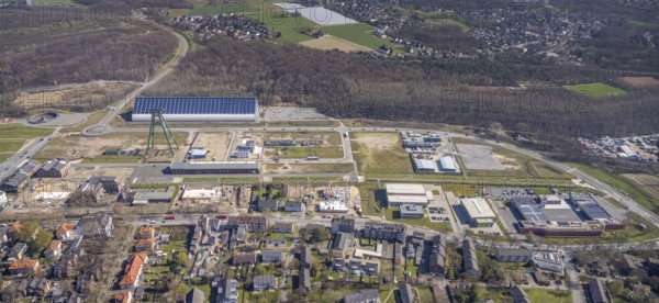 Aerial view, Bergpark Lohberg, former Lohberg colliery site, winding tower, water tower, Lohberg colliery workshop, Oberlohberg, Dinslaken, Ruhr area, North Rhine-Westphalia, Germany, construction area, construction site, construction project, CO2-neutral site, DE, Europe, design concept, commercial area, commercial use, green area, Hünxer Straße, industrial plants, industrial area, industrial site, Lohberg power station, Lohberg creative quarter, roundabout, culture, aerial view, aerial photography, aerial photography, Lower Rhine, Ober-Lohberg-Allee, park, overview, bird's-eye view, birds-eyes view, former Lohberg coal mine, former colliery site, creative use, cultural use, overview
