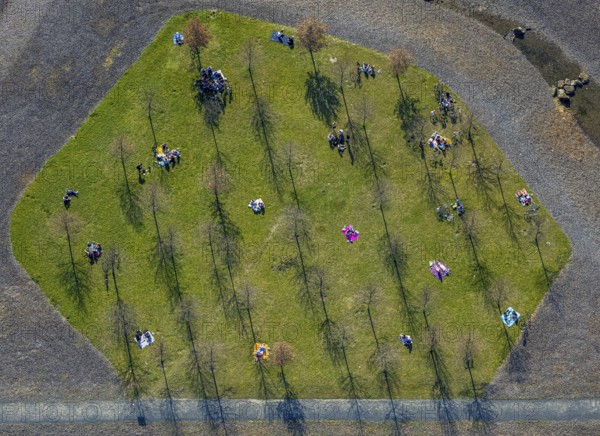 Aerial view, small sunbathing lawn on the slag heap between Westfalenpark, Emscher and viaduct Hympendahlbrücke, north of Phönix-West, spring weather on Dortmund's sunbathing lawns, Friedrichsfeld, Voerde, Ruhr area, North Rhine-Westphalia, Germany, DE, Europe, birds-eyes view, aerial view, aerial photography, aerial photography, overview, bird's eye view, spring, summer weather in March, Dortmund sunbathing lawns, sunbathing with Corona distance