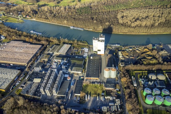 Aerial view Agravis silo tower concentrated feed plant in the industrial area east at the Wesel-Datteln canal in Dorsten in the Ruhr area in North Rhine-Westphalia, Germany, Agravis Raiffeisen AG, DE, Germany, Dorsten, Europe, commercial enterprises, commercial area, commercial park, commercial location, commercial use, industrial area, industrial building, industrial location, aerial view, aerial photograph, aerial photography, aerial photography, North Rhine-Westphalia, Ruhr area, overview, bird's-eye view, Wesel-Datteln Canal, birds-eyes view, compound feed manufacturer, overview
