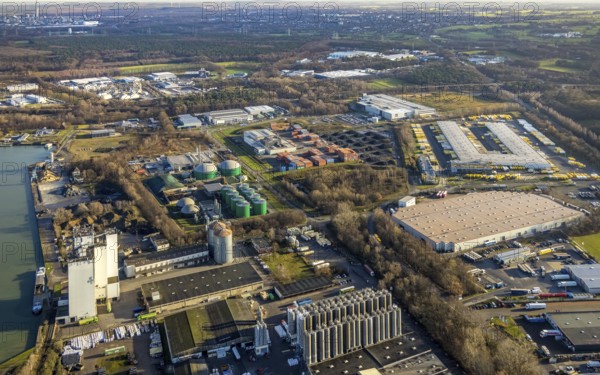 Aerial view of the Industrial Park East Dorsten-Marl with the Agravis silo tower concentrated feed plant and the biogas plant Dorsten and the DHL freight centre in the Lünsingskuhle in Dorsten in the Ruhr area in North Rhine-Westphalia, Germany, DE, Germany, Dorsten, Europe, commercial enterprises, commercial area, commercial park, commercial location, commercial use, freight traffic, industrial area, industrial building, industrial location, logistics, logistics service, logistics service provider, logistics provider, logistics centre, aerial view, aerial photograph, aerial photography, aerial photography, North Rhine-Westphalia, Ruhr area, freight forwarding, transport, transport service, overview, bird's-eye view, overview