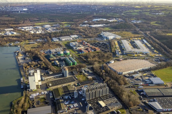 Aerial view of the Industrial Park East Dorsten-Marl with the Agravis silo tower concentrated feed plant and the biogas plant Dorsten and the DHL freight centre in the Lünsingskuhle in Dorsten in the Ruhr area in North Rhine-Westphalia, Germany, DE, Germany, Dorsten, Europe, commercial enterprises, commercial area, commercial park, commercial location, commercial use, freight traffic, industrial area, industrial building, industrial location, logistics, logistics service, logistics service provider, logistics provider, logistics centre, aerial view, aerial photograph, aerial photography, aerial photography, North Rhine-Westphalia, Ruhr area, freight forwarding, transport, transport service, overview, bird's-eye view, overview