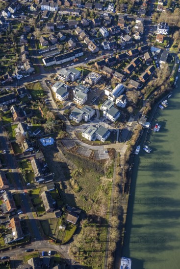 Aerial view of a construction site and new construction of residential buildings with barrier-free flats on the Wesel-Datteln Canal, Zum Leinpfad in Dorsten in the Ruhr area in North Rhine-Westphalia, Germany, construction work, construction, construction area, building site, building plots, construction measure, construction project, building site, boats, jetty, jetty, DE, Germany, Dorsten, development, Europe, capacity requirements, aerial view, aerial photography, aerial photography, aerial photography, motorboats, new construction, North Rhine-Westphalia, Ruhr area, ship, overview, bird's-eye view, Wesel-Datteln Canal, barrier-free living, birds-eyes view, overview