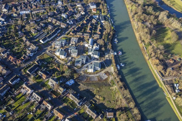 Aerial view of a construction site and new construction of residential buildings with barrier-free flats on the Wesel-Datteln Canal, Zum Leinpfad in Dorsten in the Ruhr area in North Rhine-Westphalia, Germany, construction work, construction, construction area, building site, building plots, construction measure, construction project, building site, boats, jetty, jetty, DE, Germany, Dorsten, development, Europe, capacity requirements, aerial view, aerial photography, aerial photography, aerial photography, motorboats, new construction, North Rhine-Westphalia, Ruhr area, ship, overview, bird's-eye view, Wesel-Datteln Canal, barrier-free living, birds-eyes view, overview