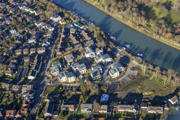 Aerial view of a construction site and new construction of residential buildings with barrier-free flats on the Wesel-Datteln Canal, Zum Leinpfad in Dorsten in the Ruhr area in North Rhine-Westphalia, Germany, construction work, construction, construction area, building site, building plots, construction measure, construction project, building site, boats, jetty, jetty, DE, Germany, Dorsten, development, Europe, capacity requirements, aerial view, aerial photography, aerial photography, aerial photography, motorboats, new construction, North Rhine-Westphalia, Ruhr area, ship, overview, bird's-eye view, Wesel-Datteln Canal, barrier-free living, birds-eyes view, overview