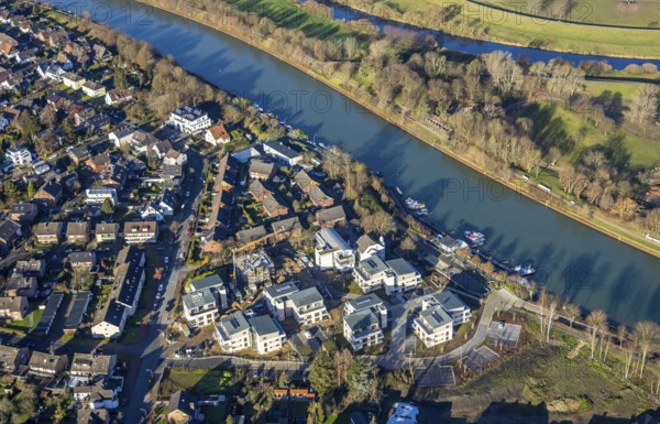 Aerial view of a construction site and new construction of residential buildings with barrier-free flats on the Wesel-Datteln Canal, Zum Leinpfad in Dorsten in the Ruhr area in North Rhine-Westphalia, Germany, construction work, construction, construction area, building site, building plots, construction measure, construction project, building site, boats, jetty, jetty, DE, Germany, Dorsten, development, Europe, capacity requirements, aerial view, aerial photography, aerial photography, aerial photography, motorboats, new construction, North Rhine-Westphalia, Ruhr area, ship, overview, bird's-eye view, Wesel-Datteln Canal, barrier-free living, birds-eyes view, overview