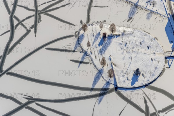 Aerial view, snowy Phoenix Lake, Hörde, Dortmund, Ruhr area, North Rhine-Westphalia, Germany, DE, Europe, aerial photography, aerial photography, aerial photography, snow, lake, overview, bird's eye view, winter, winter slump, winter landscape, birds-eyes view, overview, ice, ice surface, thin ice, break in the ice, breaks in the ice, snowy ice surface, artificial lake