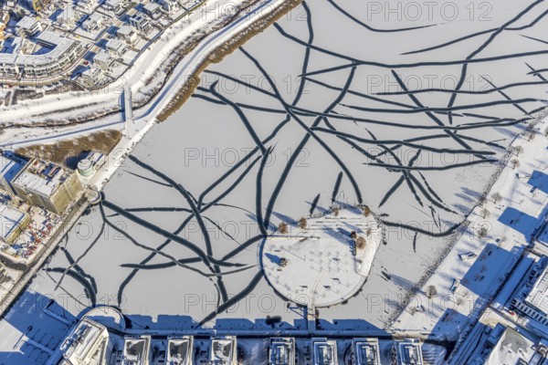 Aerial view, snowy Phoenix Lake, Hörde, Dortmund, Ruhr area, North Rhine-Westphalia, Germany, DE, Europe, aerial photography, aerial photography, aerial photography, snow, lake, overview, bird's eye view, winter, winter slump, winter landscape, birds-eyes view, overview, ice, ice surface, thin ice, break in the ice, breaks in the ice, snowy ice surface, artificial lake
