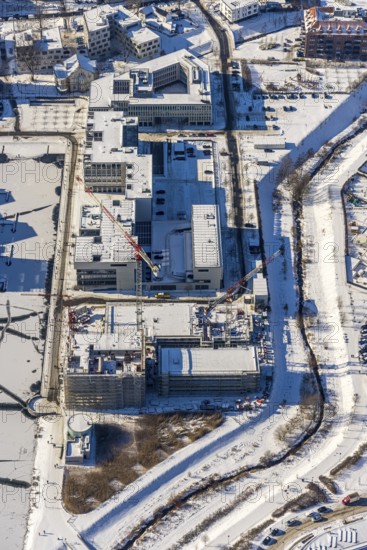 Aerial view, snow-covered Phoenix Lake, construction site of a retirement home, Hörde, Dortmund, Ruhr area, North Rhine-Westphalia, Germany, DE, Europe, commercial buildings, aerial view, aerial photography, aerial photography, snow, lake, overview, bird's eye view, winter, winter onset, winter landscape, birds-eyes view, overview, ice, ice surface, thin ice, break in the ice, breaks in the ice, snow-covered ice surface, artificial lake
