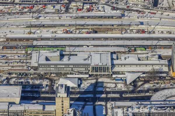Aerial view, main station, city, Dortmund, Ruhr area, North Rhine-Westphalia, Germany, railway tracks, station, station forecourt, DE, Deutsche Bahn AG, Europe, railway tracks, main station, aerial view, aerial photography, aerial photography, snow, overview, bird's-eye view, winter, winter snowfall, winter landscape, birds-eyes view, overview, station concourse in the snow