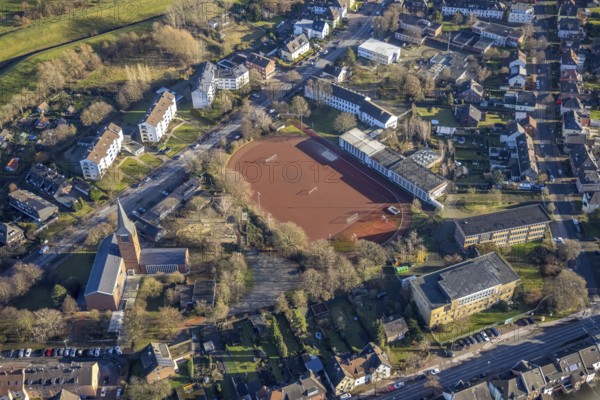 Aerial view of St John's Church in Beethovenstraße and St John's Catholic Kindergarten and Geschwister-Scholl-School next to the sports field in Dorsten in the Ruhr area in North Rhine-Westphalia, Germany, worship place, education, educational institution, DE, Germany, Dorsten, Europe, football pitch, religious community, place of worship, holy place, kindergarten, day nursery, day care centre, church, church community, day care centre, denomination, educational institute, aerial view, aerial photograph, aerial photography, aerial photography, North Rhine-Westphalia, religion, religious site, Ruhr area, school, sports facilities, sports field, sports facility, overview, bird's eye view, birds-eyes view, overview