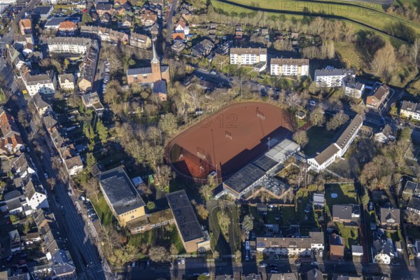 Aerial view of St John's Church in Beethovenstraße and St John's Catholic Kindergarten and Geschwister-Scholl-School next to the sports field in Dorsten in the Ruhr area in North Rhine-Westphalia, Germany, worship place, education, educational institution, DE, Germany, Dorsten, Europe, football pitch, religious community, place of worship, holy place, kindergarten, day nursery, day care centre, church, church community, day care centre, denomination, educational institute, aerial view, aerial photograph, aerial photography, aerial photography, North Rhine-Westphalia, religion, religious site, Ruhr area, school, sports facilities, sports field, sports facility, overview, bird's eye view, birds-eyes view, overview