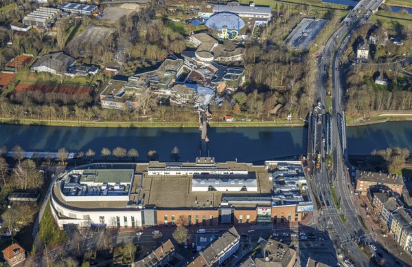 Aerial view of the shopping centre Mercaden Dorsten at the Westwall and Gymnasium Petrinum and leisure pool Atlantis at the Wesel-Datteln Canal in Dorsten in the Ruhr area in North Rhine-Westphalia, Germany, bridge, Crawleystraße, DE, Germany, Dorsten, shopping centre, shopping mall, shopping markets, shopping place, shopping centre, Europe, Hochstadenbrücke, Im Werth, aerial view, aerial photograph, aerial photography, aerial photography, local supply centre, North Rhine-Westphalia, Ruhr area, shopping, shopping, shopping centre, Dorsten municipal library, overview, VHS, bird's-eye view, Wesel-Datteln-Kanal, birds-eyes view, overview