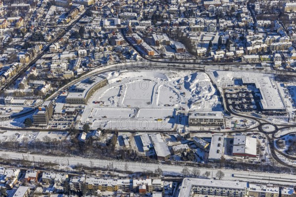 Aerial view, Hombrucher Bogen, construction site for commercial areas and apartment buildings, Barop, Dortmund, Ruhr area, North Rhine-Westphalia, Germany, construction work, construction area, construction site, building plots, construction project, construction site, DE, Europe, aerial view, aerial photography, aerial photography, new building, snow, overview, bird's eye view, winter, winter slump, winter landscape, birds-eyes view, former prefabricated concrete plant at Luisenglück, overview