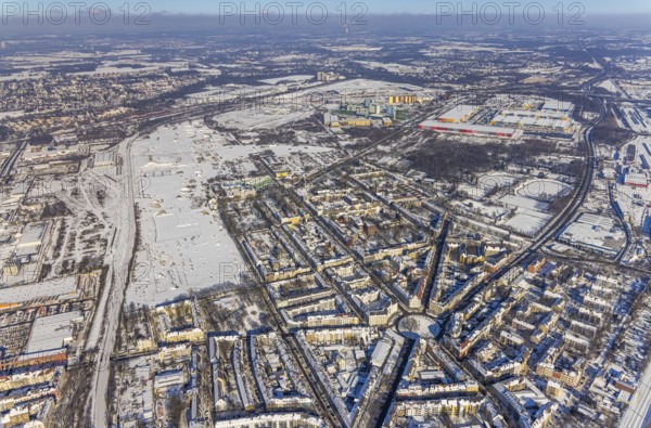 Aerial view, Westfalenhütte site, winter at Borsigplatz, Dortmund, Ruhr area, North Rhine-Westphalia, Germany, Amazon Logistik Dortmund, DE, Europe, commercial enterprises, commercial area, commercial park, commercial location, commercial use, industrial area, industrial location, roundabout, roundabout, aerial photograph, aerial photography, aerial photography, snow, overview, bird's-eye view, winter, onset of winter, winter landscape, living and life, residential buildings, bird's-eye view, overview, thyssenkrupp Steel Europe