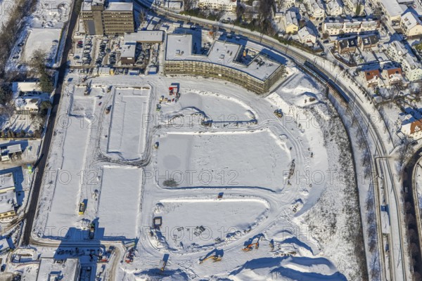 Aerial view, Hombrucher Bogen, construction site for commercial areas and apartment buildings, Barop, Dortmund, Ruhr area, North Rhine-Westphalia, Germany, construction work, construction area, construction site, building plots, construction project, construction site, DE, Europe, aerial view, aerial photography, aerial photography, new building, snow, overview, bird's eye view, winter, winter slump, winter landscape, birds-eyes view, former prefabricated concrete plant at Luisenglück, overview