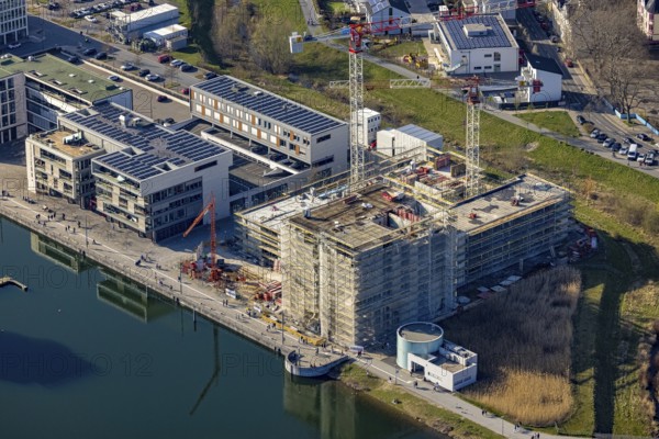 Aerial view, Phoenix-See, construction site for a new retirement home, high-rise building H12, Hörde, Dortmund, Ruhr area, North Rhine-Westphalia, Germany, construction work, construction area, construction site, building plots, construction crane, construction measure, construction project, construction site, DE, Europe, aerial view, aerial photography, aerial photography, new construction, Phoenix Lake, overview, bird's-eye view, former steelworks area Phoenix-East, artificial lake, overview