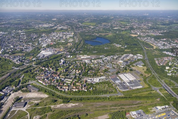 Aerial view, commercial area Höfkerstraße and Arminiusstraße, Revierpark Wischlingen and Hallerey Reserve nature reserve in the background, Dorstfeld and Huckarde, harbour, Dortmund, Ruhr area, North Rhine-Westphalia, Germany, DE, DSW21 depot Dorstfeld, Europe, distant view, commercial enterprises, commercial area, commercial area, commercial location, commercial use, industrial area, industrial location, aerial view, aerial photography, aerial photography, lake, overview, bird's-eye view, overview
