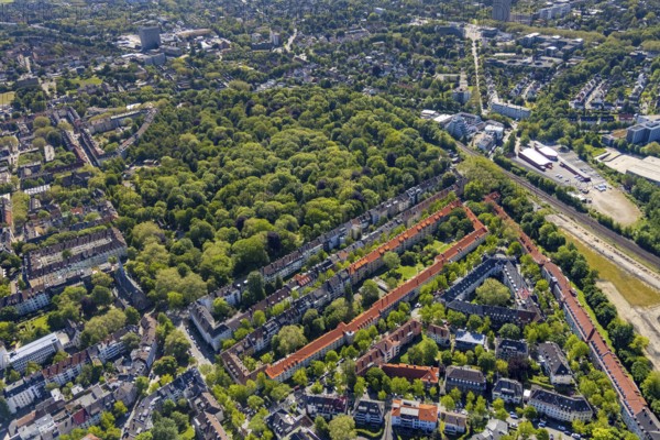 Aerial view, residential area Von-der-Goltz-Straße and Düsseldorfer Straße with red roofs, wooded area Ostfriedhof, Kaiserbrunnen, Dortmund, Ruhr area, North Rhine-Westphalia, Germany, burial site, DE, Europe, cemetery, memorial, Gottesacker, land tax, graves, burial ground, real estate, aerial view, aerial photography, aerial photography, Ostpark, resting place, overview, bird's-eye view, housing estate, housing and living, residential area, residential buildings, residential quality, residential neighbourhood, housing estate, birds-eyes view, overview