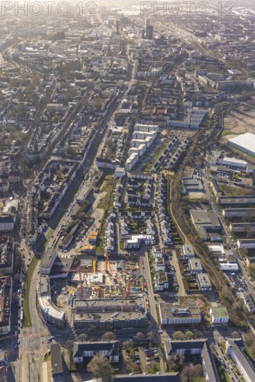 Aerial view, construction site for new Kaiserquartier, Klönnestraße, new development area Kaiserstraße, Kaiserbrunnen, Dortmund, Ruhr area, North Rhine-Westphalia, Germany, construction work, construction area, construction site, building plots, construction crane, construction project, construction site, DE, Europe, aerial view, aerial photography, aerial photography, new building, snow, overview, bird's-eye view, overview